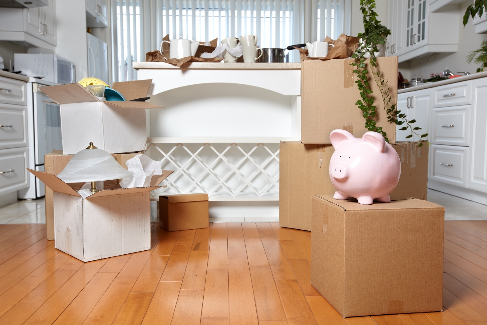 Moving boxes in new house. New apartment background.