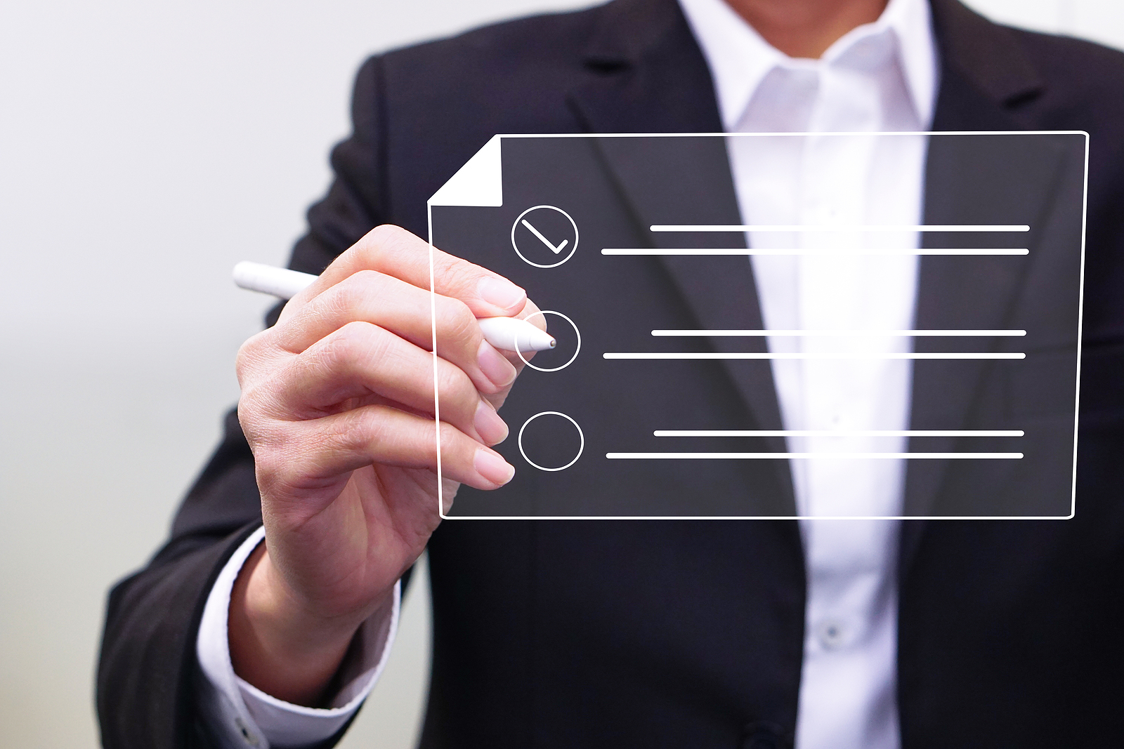 Businessman working on a digital document on a virtual screen using a stylus pen. Concept of Technology and future document management.