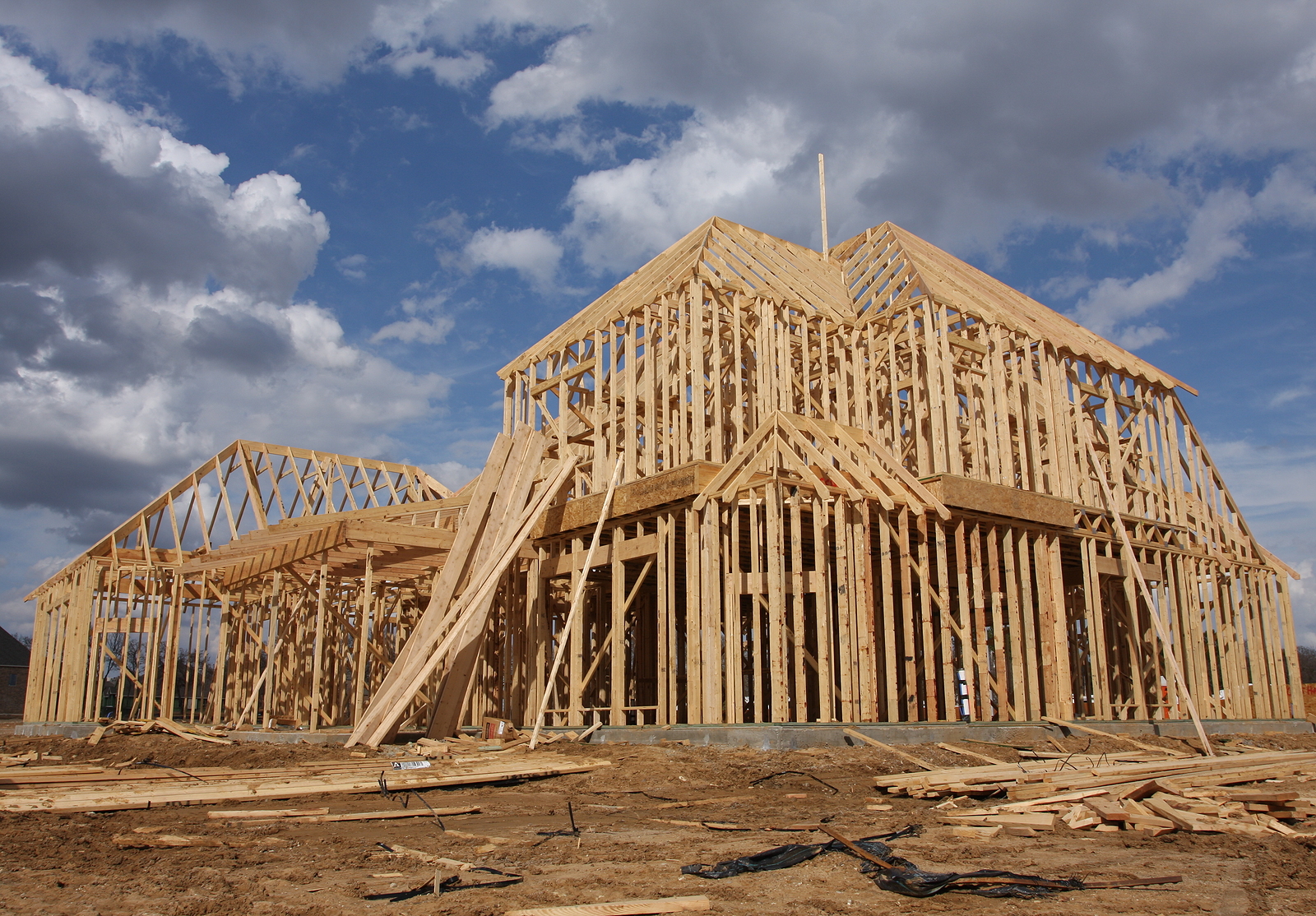 Full shot wooden frame of a home under construction