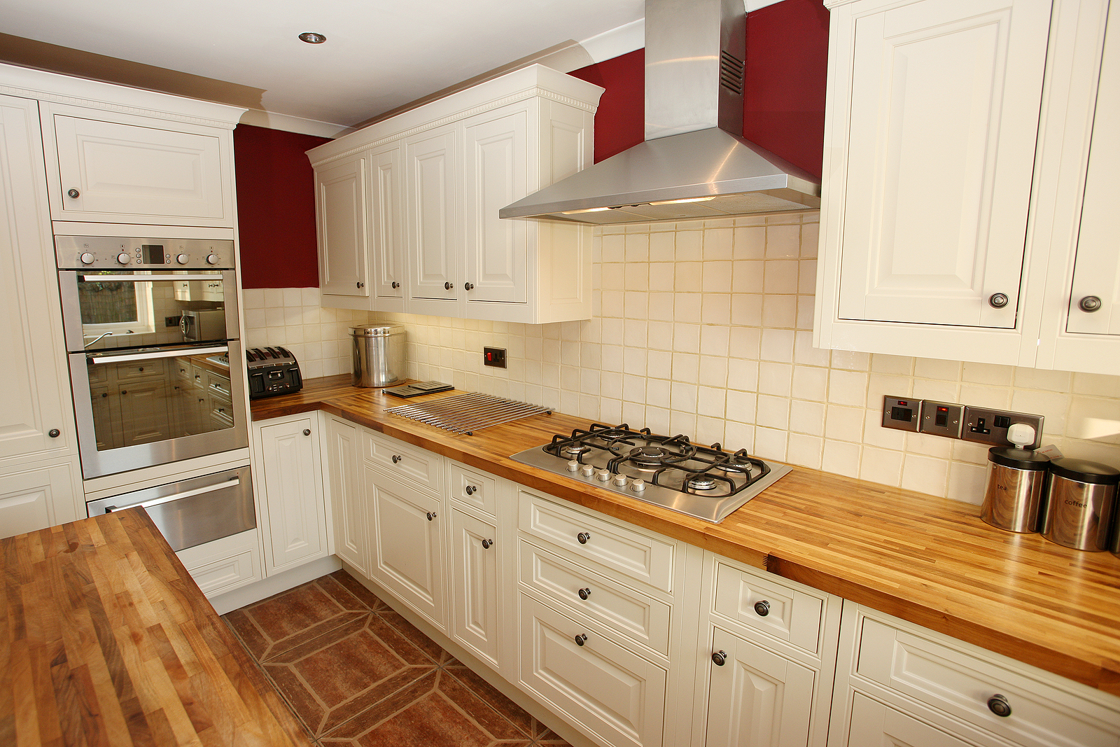 Country-style kitchen interior with modern integrated appliances