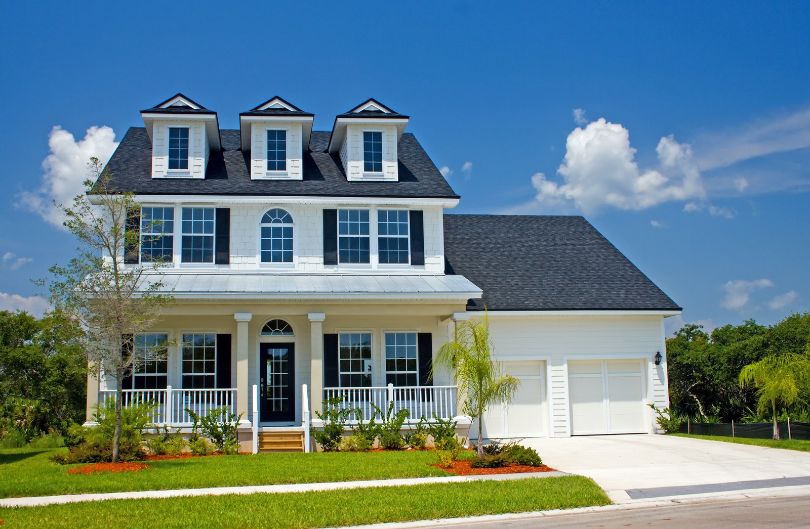 coastal living home in Florida with cracker style tin roof accent