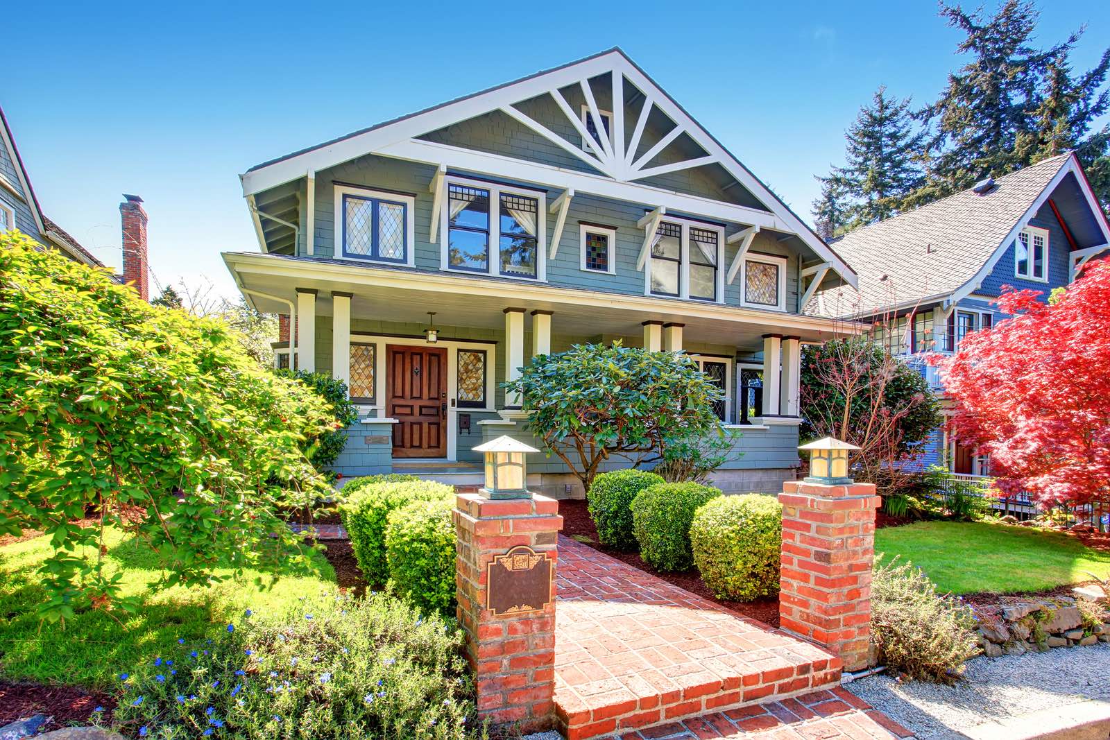 Gorgeous American home with blue exterior and white trim.