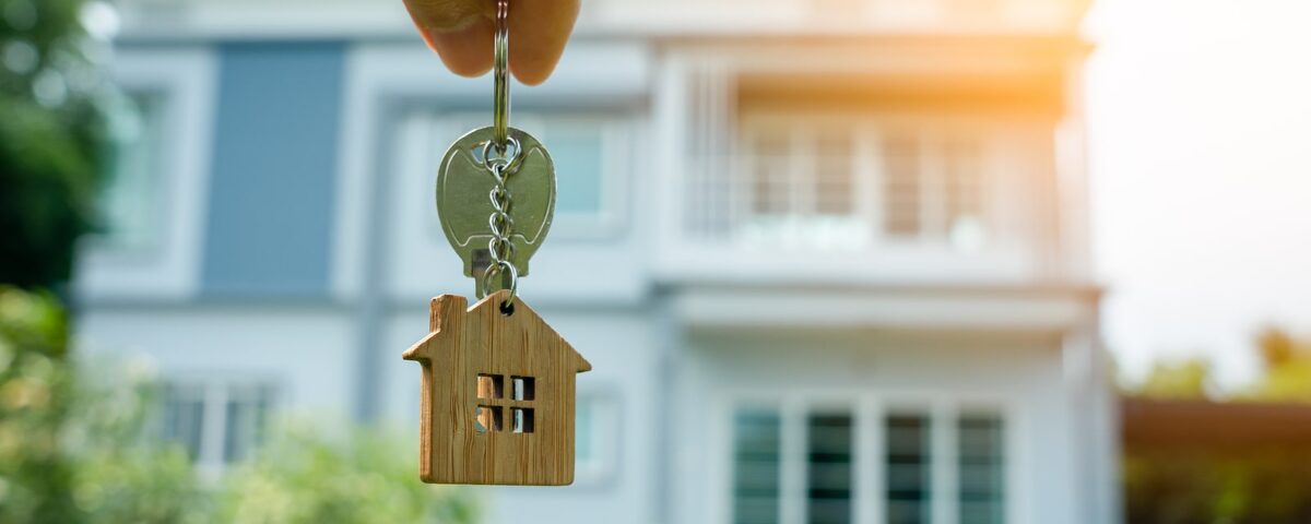 Closeup of person holding key to a new home
